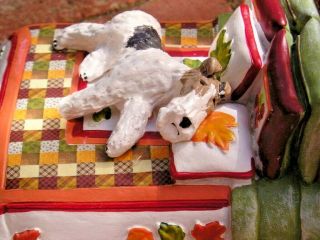 Wire Fox Terrier Sleeping On A Colorful Bed