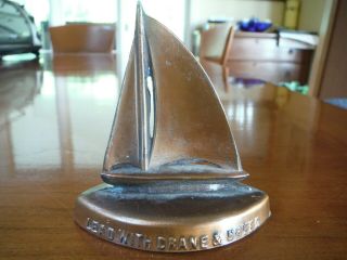 CRANE & BREED CASKET CO.  METAL SAILBOAT PAPERWEIGHT - OLD & 4