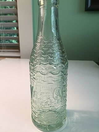 Unique Waves Design Deco Soda Bottle Embossed " White Cap Beverages " Green Tint