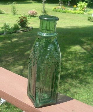 11 1/2  DARK GREEN BLUE EMBOSSED CATHEDRAL PICKLE BOTTLE HEAVY EMBOSSING 2