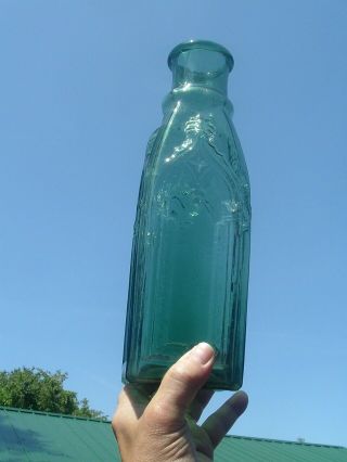 11 1/2  DARK GREEN BLUE EMBOSSED CATHEDRAL PICKLE BOTTLE HEAVY EMBOSSING 5