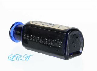 Antique Sharp & Dohme Cobalt Blue Triangle Embossed And Labeled Bottle