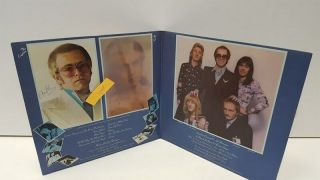 Elton John - Captain Fantastic LP Sleeve signed by Elton John & Bernie Taupin 8