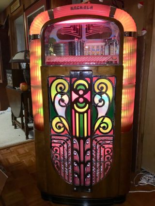 Rock - Ola Jukebox.  Plays Great,  Lighting And Action On Front.  Ship