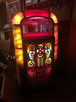 Rock - ola Jukebox.  Plays Great,  Lighting And Action On Front.  Ship 6
