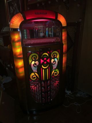 Rock - ola Jukebox.  Plays Great,  Lighting And Action On Front.  Ship 7