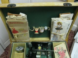 Toy Singer Sewing Machine In The Case Wiith The Singer Doll And Oil Can And Inst