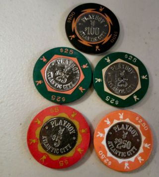 Group Of 5 Playboy Coin In Center Chips Atlantic City $100,  (2) $25,  $5,  $2.  50