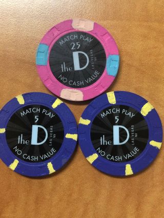 The D Casino Las Vegas Match Play Chips 1 - $25 And 2 - $5.  Total $35