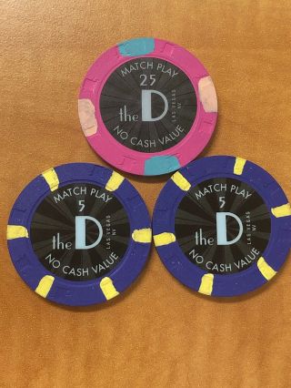 The D Casino Las Vegas Match Play Chips 1 - $25 and 2 - $5.  Total $35 2