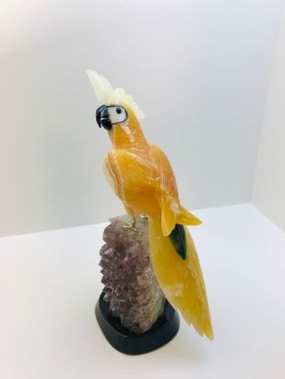 Hand Carved Orange And Green With White Crest Cockatoo Perched On Amethyst Base