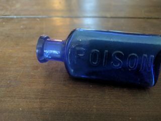 THE OWL DRUG CO.  COBALT BLUE POISON BOTTLE 3 1/4 inch tall triangle 2