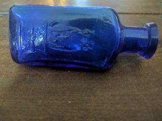 THE OWL DRUG CO.  COBALT BLUE POISON BOTTLE 3 1/4 inch tall triangle 3