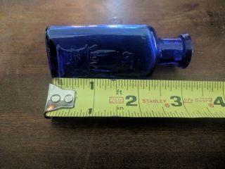 THE OWL DRUG CO.  COBALT BLUE POISON BOTTLE 3 1/4 inch tall triangle 4
