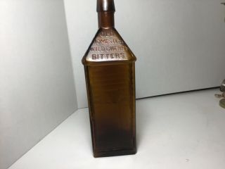 Old Homestead Wild Cherry Bitters - Medium Amber,  Cabin Shaped 2