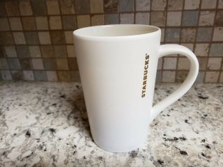 Starbucks 2012 White With Gold Lettering 12 Oz Tall Ceramic Coffee Latte Mug Cup