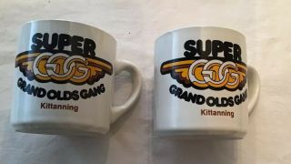 2 Oldsmobile Coffee Mug Grand Olds Gang Kittaning Advertising