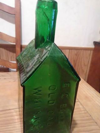 E.  C.  Booz ' s Old Cabin Whiskey Bottle Green Color 1840 120 Walnut St. 2