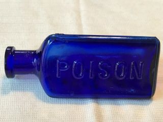 THE OWL DRUG CO. ,  cobalt blue poison bottle,  3 Sided,  Embossed 4.  75” 2