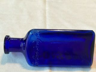 THE OWL DRUG CO. ,  cobalt blue poison bottle,  3 Sided,  Embossed 4.  75” 3