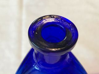 THE OWL DRUG CO. ,  cobalt blue poison bottle,  3 Sided,  Embossed 4.  75” 5