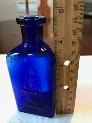 THE OWL DRUG CO. ,  cobalt blue poison bottle,  3 Sided,  Embossed 4.  75” 6
