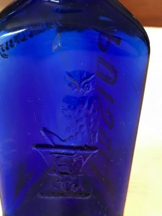 THE OWL DRUG CO. ,  cobalt blue poison bottle,  3 Sided,  Embossed 4.  75” 8