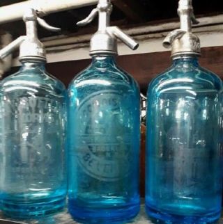 A Trio Of Brooklyn Blue Colorfilled Seltzer Bottles