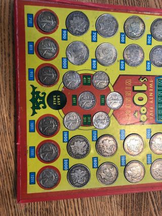 Punchboard Prize Board with 20 Silver Dollars and 12 half - dollars. 4