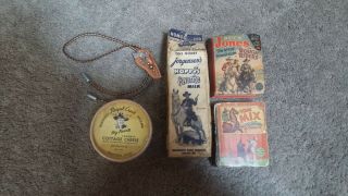 Hopalong Cassidy Milk Cont. ,  Cottage Cheese Cont. ,  Bolo Tie,  Two Little Books