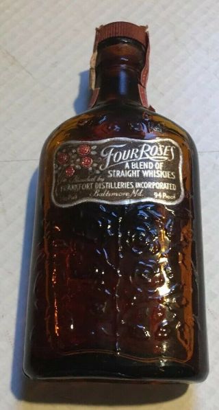 Four Roses A Blend Of Straight Whiskies 1/10th Pint Embossed Bottle Still
