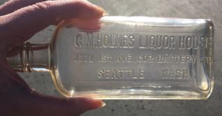 Seattle,  Wash.  G.  M.  Holmes Liquor House Half Pint Embossed Whiskey Flask