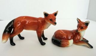 Vintage Porcelain Foxes Figurines.  Signed.  Fox Set