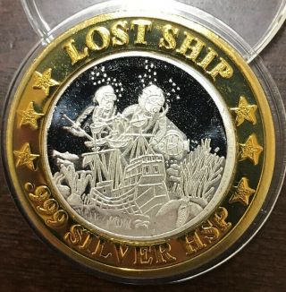 Norwegian Cruise Lines Casino Silver Strike Lost Ship Gaming Token.  999 Coin 2