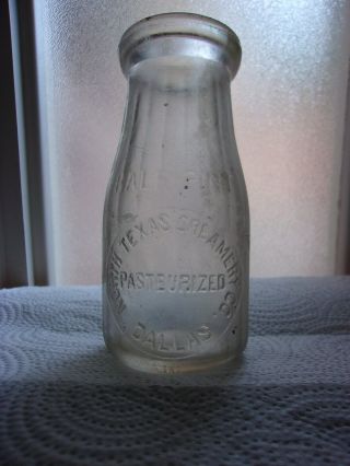 North Texas Creamery Co. ,  Dallas Embossed 1/2 Pint Milk Bottle C.  1915 - 1920