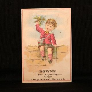 Down’s Corset Boy With Flowers Trade Card - Deerfield Wi