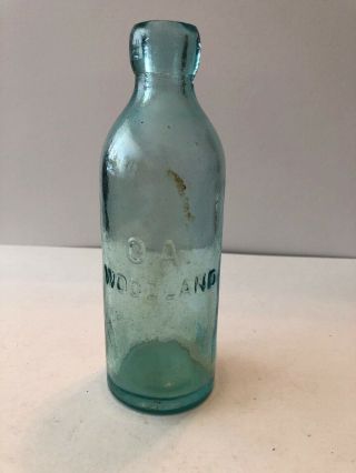 O.  A.  Woodland Aqua Blob Top Soda Bottle