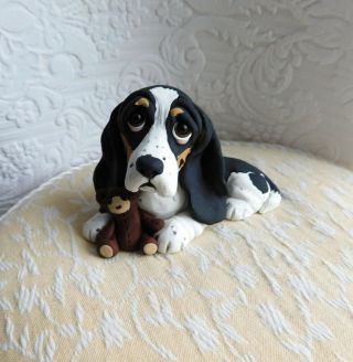 Basset Hound With Teddy Bear Clay Sculpture By Raquel At Thewrc