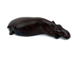 Carved Wooden Hippo Laying Down Figurine