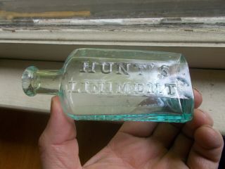 SING SING,  NY HUNT ' S LINIMENT G.  E.  STANTON 1860 EARLY HINGE MOLD DRIPPY LIP BOTTLE 2