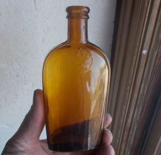 1880s Golden Amber 1/2 Pint Strap Side Whiskey Flask Emb Star In Circle