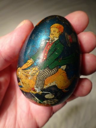 Estate Find - Old Antique Tin Litho Easter Egg Candy Container " Boy Riding Rabbit "