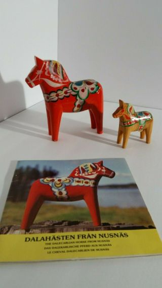 Two Vtg Dala Horses And Souvenir Book.  Nils Olson Stickers On Bellies.  Swedish