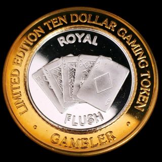 1998 G Gambler Reno Casino.  999 Silver Strike $10 Royal Flush Token 2grc9844