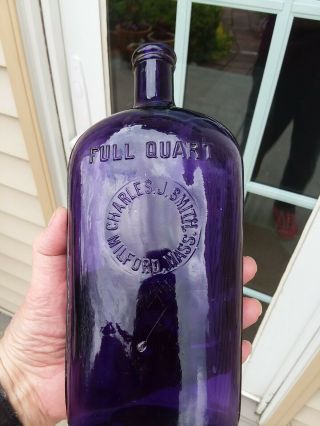 Charles J.  Smith Milford,  Mass.  Strap Sided Whiskey Flask Deep Purple Blown
