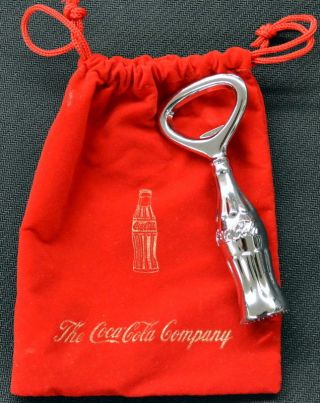 Coca - Cola Bottle Shaped Chrome Opener In Coca - Cola Company Red Velvet Bag