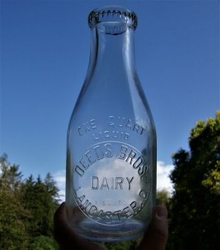 Deeds Bros.  Dairy Embossed Quart Milk Bottle Lancaster,  Ohio Fairfield Co.