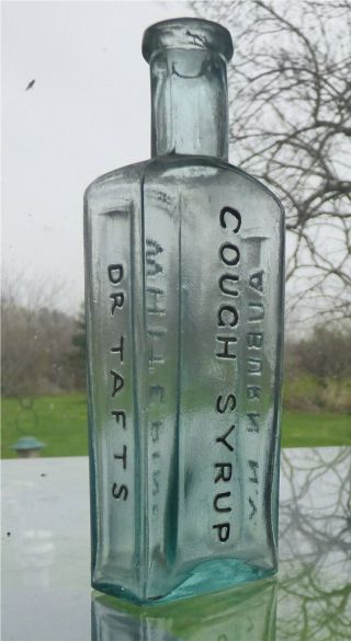 Aqua Medicine Bottle " Dr Tafts / White Pine / Cough Syrup / Auburn N.  Y.  "