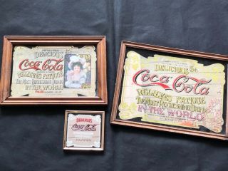 A Group Of Vintage Coca Cola Framed Advertising Mirrors