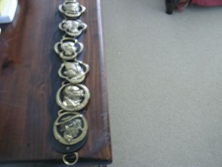 Six Brass Dickens Characters On Strap